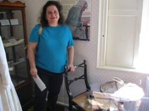 Author Marilyn Brant -- standing behind Jane Austen's actual writing desk in Chawton, England.